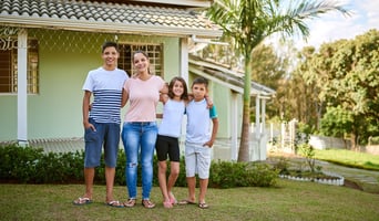 Family standing outside of their Florida home