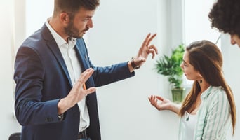 Man and Woman having a disagreement at work